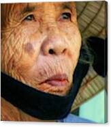 Old Vietnamese Lady With The Conical Hat Canvas Print