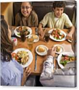 Parents And Children (8-10) Dinning In Restaurant, High Angle View Canvas Print