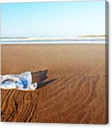 Plastic bag on beach Canvas Print