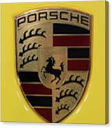 Porsche Emblem On Racing Yellow Canvas Print
