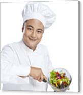 Portrait Of Chef Serving Vegetables On Plate Canvas Print