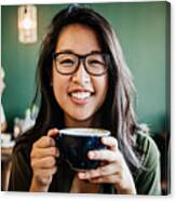 Portrait Of Young Woman Smiling Drinking Coffee Canvas Print