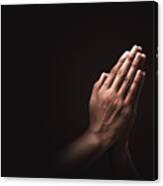 Praying Hands With Faith In Religion And Belief In God On Dark Background. Power Of Hope Or Love And Devotion. Namaste Or Namaskar Hands Gesture. Prayer Position. Canvas Print