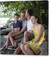 Real Family Portrait Of 4 On Riverside In Summer. Canvas Print