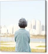 Rear View Of Senior Woman Standing By River Bank Canvas Print