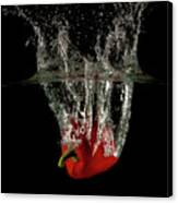 Red Bell Pepper Dropped And Slashing On Water Canvas Print