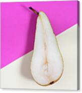 Slice Of Healthy Pear Fruit On A Colourful Background. Canvas Print