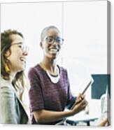 Smiling Business Colleagues In Discussion During Informal Meeting In Start Up Office Canvas Print