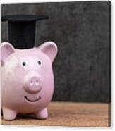 Smiling Pink Piggy Bank Wearing Graduated Hat On Wooden Table With Dark Black Background And Copy Space, Education Fund, Scholarships, University Cost And Expense Or Saving For Student Loan Concept Canvas Print
