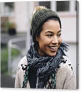 Smiling Young Woman Wearing Wooly Hat Outdoors Canvas Print