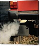 Smoke Coming From Exhaust Pipe Of A Car Canvas Print