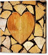 Stack Of Firewood With A Wooden Heart Canvas Print