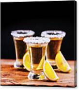 Tree Shot Glasses Of Mexican Tequila Cocktail With Lemon Slices Canvas Print