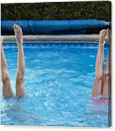 Two Preteen Girl's Legs Standing Up In Pool. Canvas Print