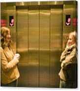 Two Young Women Waiting In Elevator Canvas Print