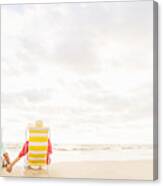 Usa, Florida, Jupiter, Rear View Of Couple Sitting In Lounge Chairs On Beach Canvas Print