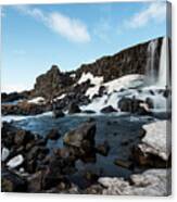 Waterfall Flowing Into The River, Iceland Canvas Print