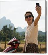 Woman Photographing Self On Moped, Vang Vieng, Laos Canvas Print
