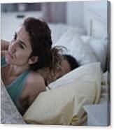 Woman Rubbing Her Neck In Bed Canvas Print