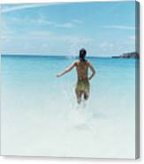 Woman Splashing In Ocean Canvas Print