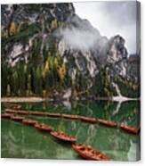 Wooden Boats On The Peaceful  Lake. Lago Di Braies, Italy Canvas Print