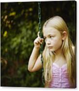 Young Girl Sitting On Swing Looking Out Canvas Print