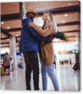 Young Multi-ethnic Friends Meeting And Embracing At Airport Canvas Print