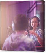Young Woman And Man Broadcasting In Recording Studio Canvas Print