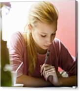 Young Woman Writing In Note Book At Cafe Table Canvas Print
