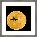 Aeroplane Silhouetted Against A Full Moon Framed Print
