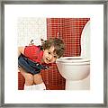 Girl Using Toilet #1 Framed Print