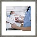 Nurse Tending Patient In Intensive Care #1 Framed Print