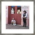 A Dog And A Re-enactor Rest In The Front Of The Bird Cage Theater Tombstone Arizona Framed Print