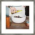 A Domestic Kitchen. A Woman Wearing An Framed Print