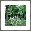A Garden With Checkered Pavement Framed Print