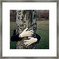 A Model Hugging A Tree Framed Print