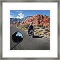 A Motorbike Rider In A Rocky Landscape Framed Print