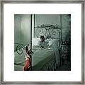 A Young Girl Lying On A Bed Framed Print