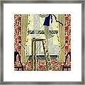 A Young Matron Adjusting Curtains Framed Print