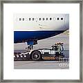 Aircraft Tug Towing Big Airliner To Dock Position Framed Print