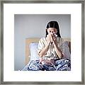 Asian Woman Have A Cold, Sitting On Cozy Bed Using Tissue For Snot. Sick At Home Framed Print