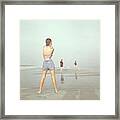 Back View Of Three People At A Beach Framed Print