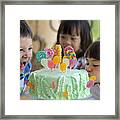 Boy And Girl Making Scarily Hungry Face On Cake Framed Print