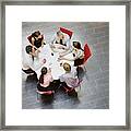 Business People Having A Meeting At Round Table Framed Print
