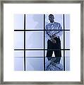 Businessman Standing Behind Window With Bars Framed Print