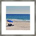 Chairs On The Beach With Umbrella Framed Print
