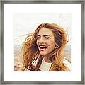 Cheerful Woman With Tousled Hair Against Cityscape Framed Print
