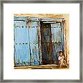 Child Sitting In Old Zanzibar Doorway Framed Print