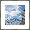 Climber Extends Helping Hand To Teammate Framed Print
