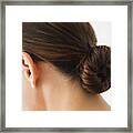 Close Up Of Woman Wearing Bun In Hair Framed Print